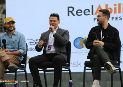 ReelAbilities Q&A of ReelAbilities International Shorts Panel. Order of appearance left to right, Michael Parks Randa, Jose Navas is talking holding the microphone ,and Ryan Mack is to his right.
